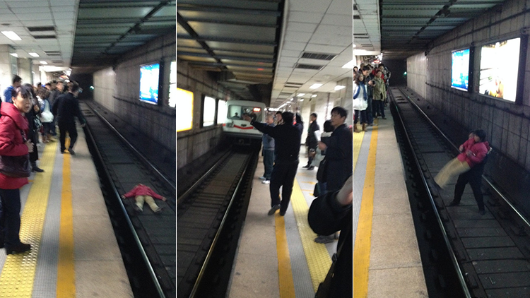 Woman saved after falling onto Beijing subway track