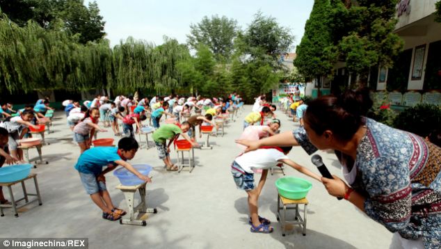 Swimming? Chinese 'anti-drowning lessons' sees kids dunking heads in buckets of water