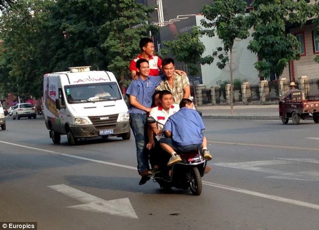 Six men, one bike: car-pooling Chinese style