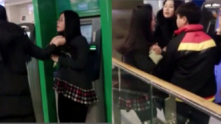 WATCH: Harbin girl knocked to ground for using ATM as dressing table