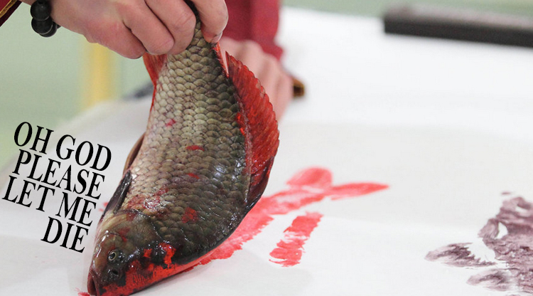 PHOTOS: Hangzhou artist paints with live fish and his mouth