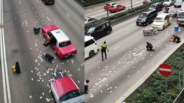 WATCH: Humanity's true face revealed after millions of dollars pour onto Hong Kong road