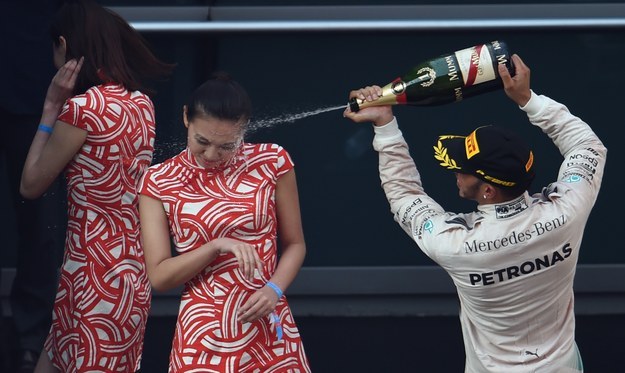At Shanghai Grand Prix, grid girl gets champagne face shot care of Lewis Hamilton